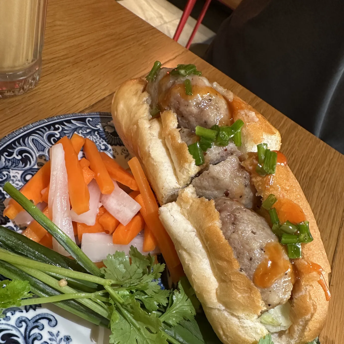 Bánh mì filled with pork, pickled carrot and coriander