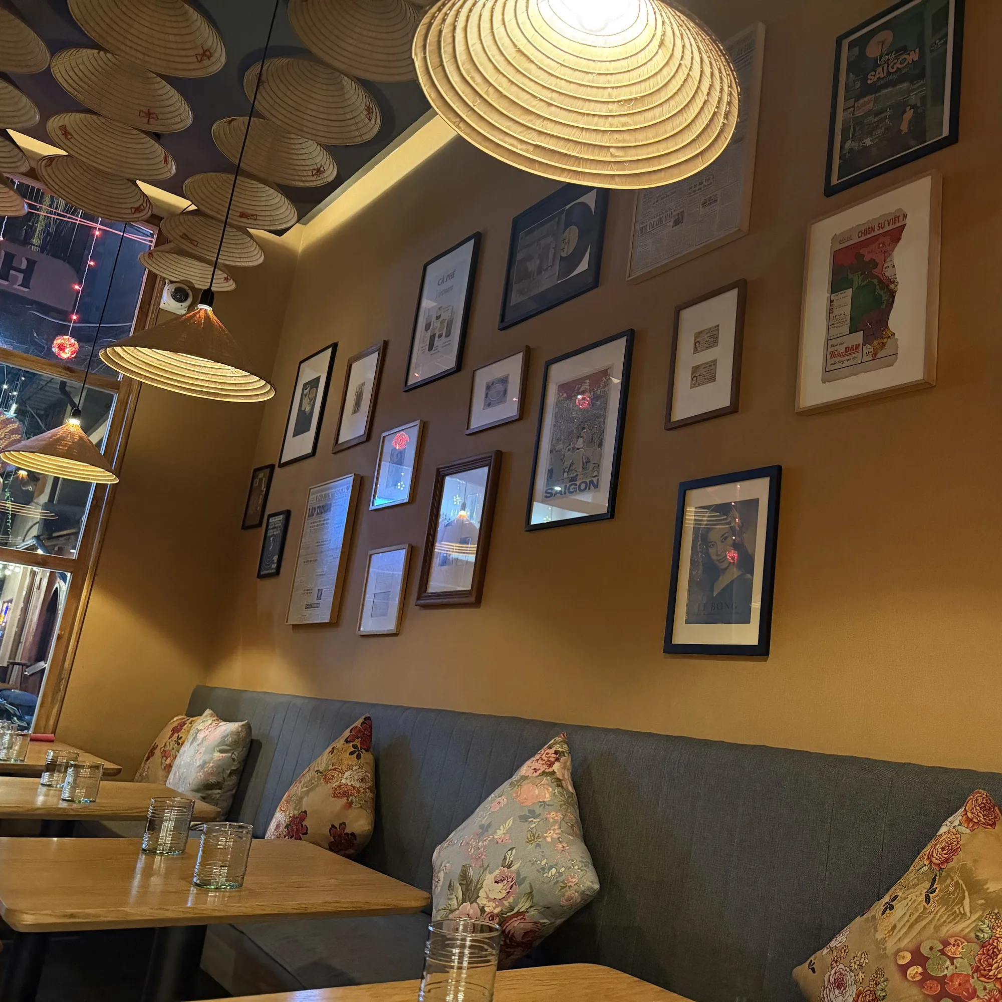 Framed posters and prints along a wall of the dining room
